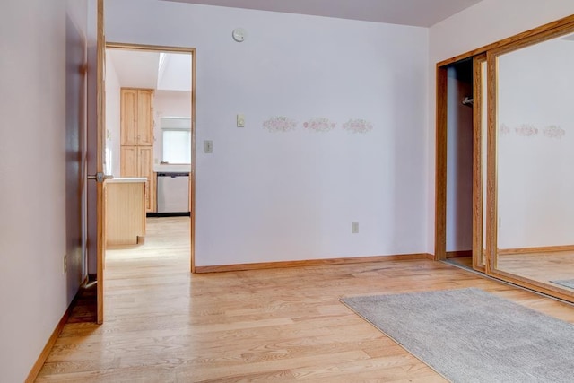 1600 26th Ave, Menominee, MI 49858 - empty room featuring light wood-style floors, baseboards, and a smoke detector