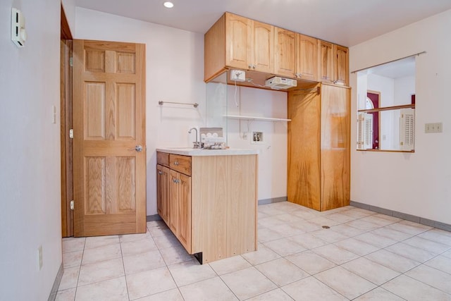 1600 26th Ave, Menominee, MI 49858 - kitchen featuring light countertops, light brown cabinetry, baseboards, light tile patterned floors, and recessed lighting