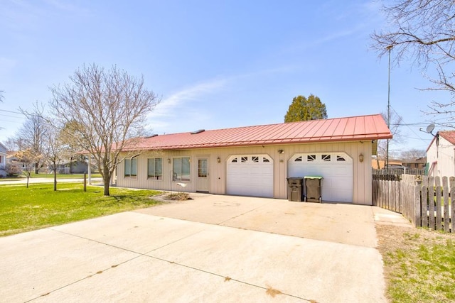 1600 26th Ave, Menominee, MI 49858 - ranch-style house featuring board and batten siding, metal roof, concrete driveway, and a standing seam roof