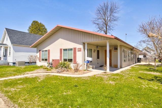 1600 26th Ave, Menominee, MI 49858 - rear view of house with a lawn and a shingled roof