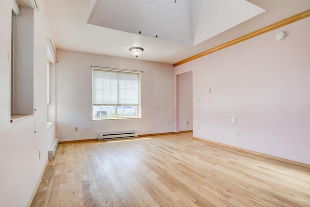 1600 26th Ave, Menominee, MI 49858 - spare room with a baseboard heating unit, baseboard heating, light wood-type flooring, a smoke detector, and baseboards