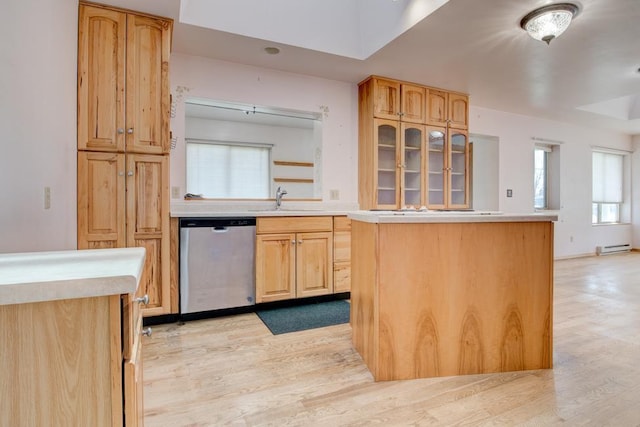 1600 26th Ave, Menominee, MI 49858 - kitchen with dishwasher, light wood finished floors, a sink, and light countertops