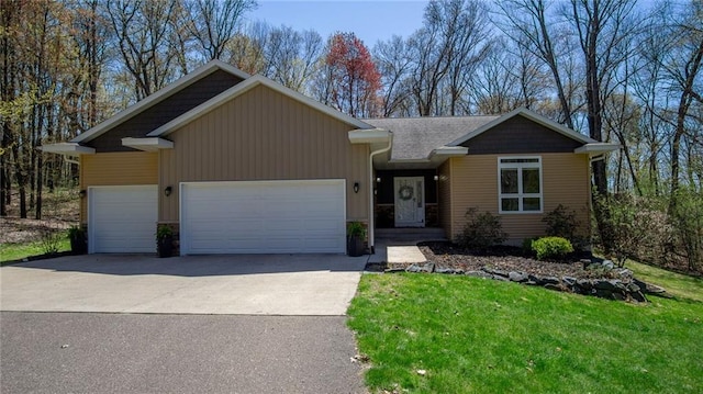 129 Grey Friar Ln, Eau Claire, WI 54701 - view of front facade with a garage, driveway, and a front lawn