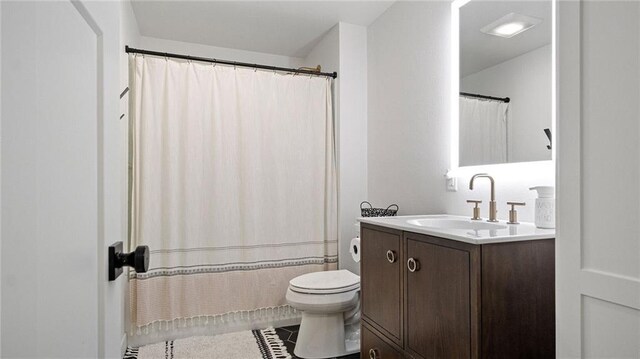 129 Grey Friar Ln, Eau Claire, WI 54701 - full bath featuring toilet, vanity, tile patterned floors, and curtained shower