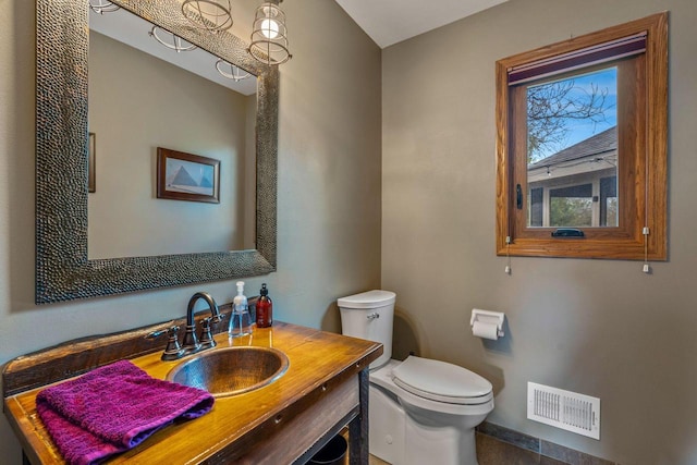 W343S9320 Jericho Dr, Eagle, WI 53119 - half bath featuring toilet, vanity, and baseboards