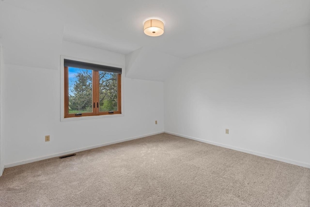 W343S9320 Jericho Dr, Eagle, WI 53119 - bonus room featuring carpet, vaulted ceiling, and baseboards
