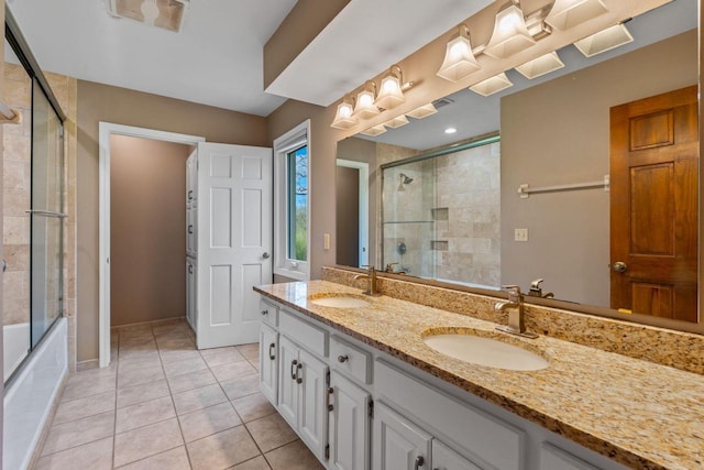 W343S9320 Jericho Dr, Eagle, WI 53119 - bathroom with double vanity, tile patterned flooring, baseboards, and tiled shower / bath