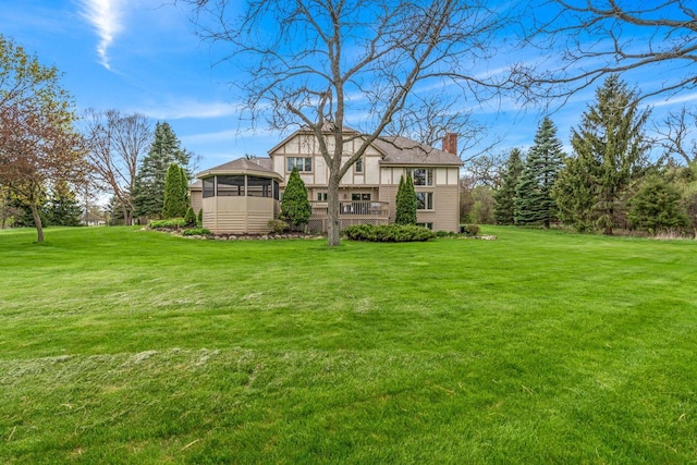 W343S9320 Jericho Dr, Eagle, WI 53119 - back of house with a chimney and a lawn