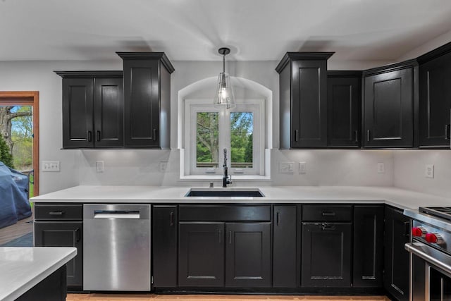 W343S9320 Jericho Dr, Eagle, WI 53119 - kitchen featuring stainless steel appliances, a sink, dark cabinets, and light countertops