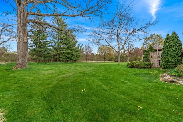 W343S9320 Jericho Dr, Eagle, WI 53119 - view of green lawn with a deck