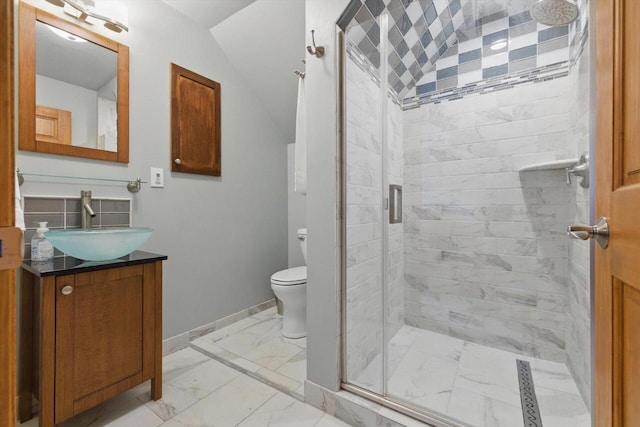 628 Sedge Meadow Ct, Summit, WI 53066 - full bathroom featuring marble look tile flooring, a shower stall, toilet, vanity, and baseboards