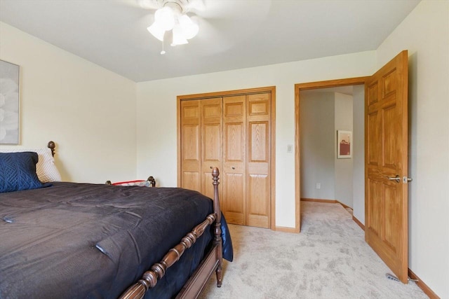 628 Sedge Meadow Ct, Summit, WI 53066 - bedroom featuring light colored carpet, a closet, baseboards, and ceiling fan