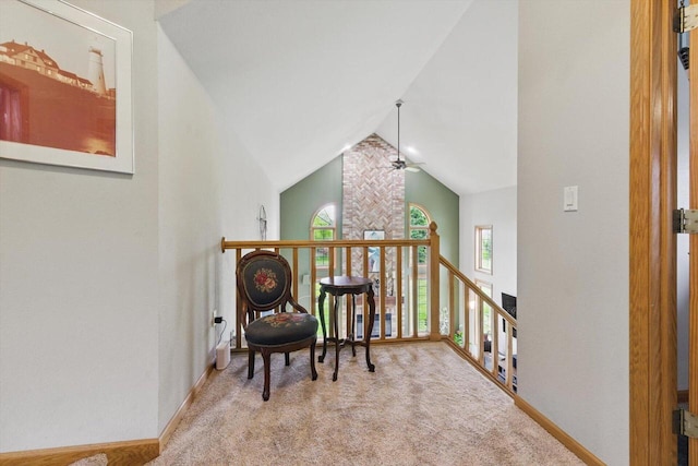628 Sedge Meadow Ct, Summit, WI 53066 - living area with carpet floors, an upstairs landing, ceiling fan, baseboards, and high vaulted ceiling