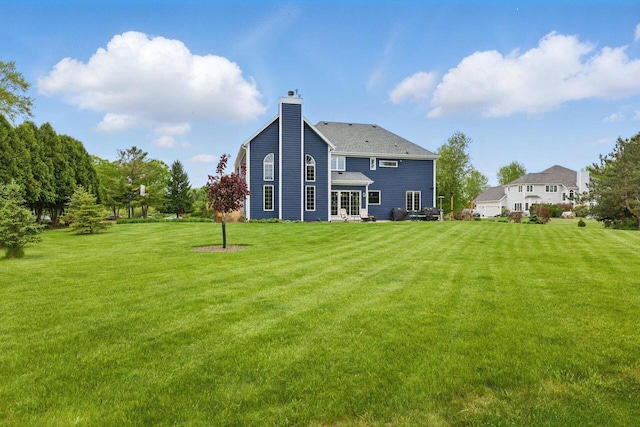 628 Sedge Meadow Ct, Summit, WI 53066 - back of property featuring a chimney and a lawn