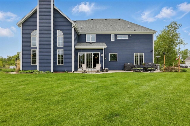 628 Sedge Meadow Ct, Summit, WI 53066 - rear view of property with a patio area, a chimney, a yard, and a shingled roof