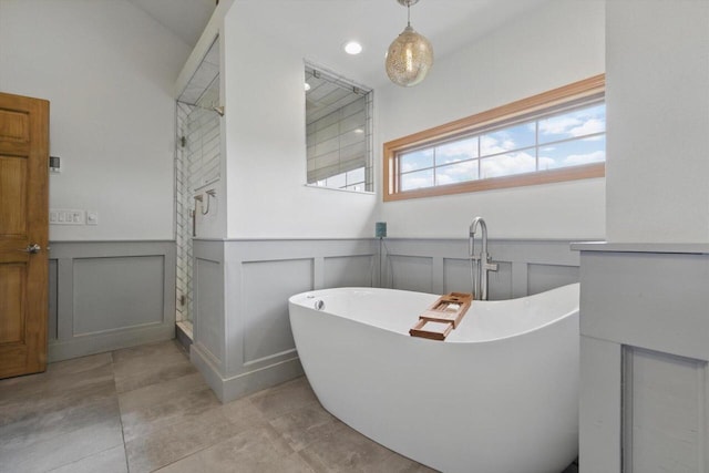 628 Sedge Meadow Ct, Summit, WI 53066 - full bath featuring a decorative wall, a soaking tub, a wainscoted wall, tile patterned floors, and a walk in shower