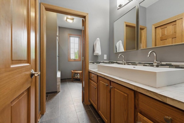 628 Sedge Meadow Ct, Summit, WI 53066 - bathroom featuring vanity, tile patterned floors, and baseboards