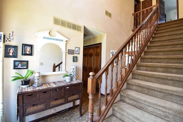3001 Revere Rd, Plover, WI 54406 - staircase featuring a towering ceiling