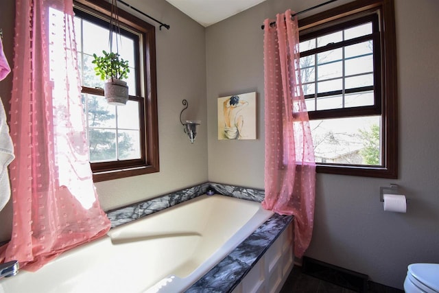 3001 Revere Rd, Plover, WI 54406 - full bath with a garden tub, toilet, and baseboards