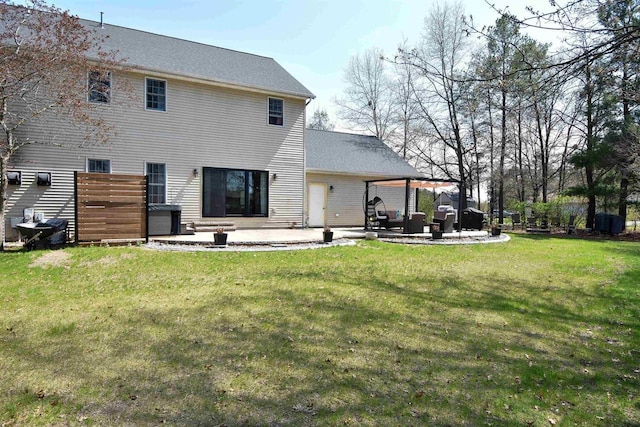 3001 Revere Rd, Plover, WI 54406 - back of house featuring a patio and a lawn