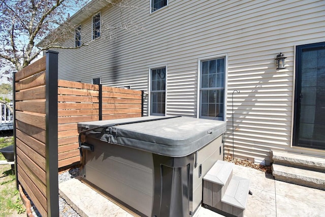 3001 Revere Rd, Plover, WI 54406 - view of patio / terrace featuring a hot tub and fence