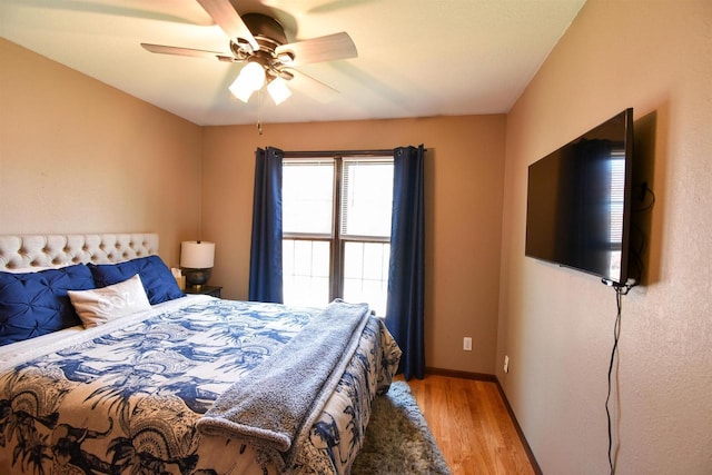 3001 Revere Rd, Plover, WI 54406 - bedroom featuring light wood-type flooring, ceiling fan, and baseboards