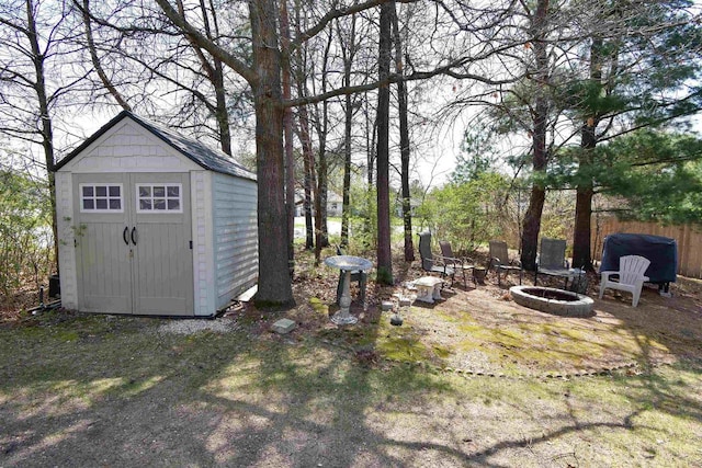 3001 Revere Rd, Plover, WI 54406 - view of yard with a fire pit, a storage shed, and an outbuilding