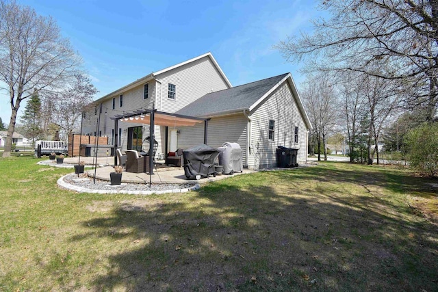 3001 Revere Rd, Plover, WI 54406 - back of property with a pergola, a patio area, and a lawn