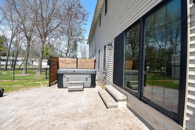3001 Revere Rd, Plover, WI 54406 - view of patio / terrace featuring a hot tub and fence