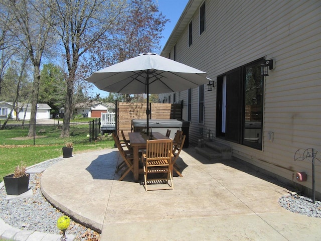 3001 Revere Rd, Plover, WI 54406 - view of patio / terrace with a hot tub, fence, entry steps, and outdoor dining space
