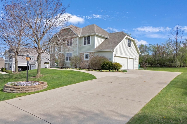 N53W16789 Prairie Dawn, Menomonee Falls, WI 53051 - view of property exterior with a yard, driveway, and a garage
