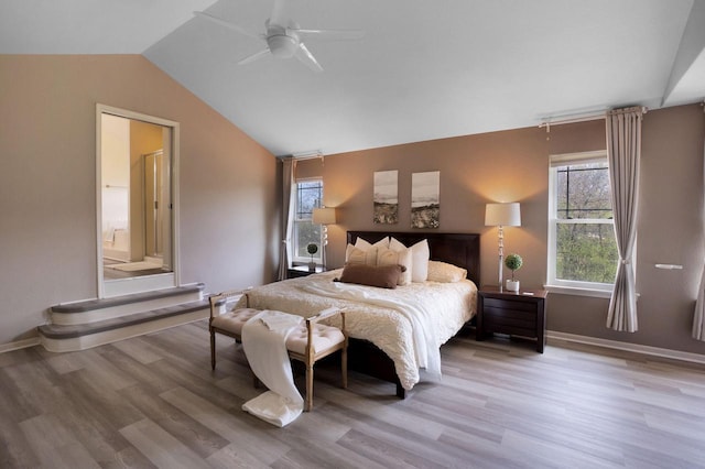N53W16789 Prairie Dawn, Menomonee Falls, WI 53051 - bedroom featuring vaulted ceiling, wood finished floors, ensuite bath, baseboards, and a ceiling fan