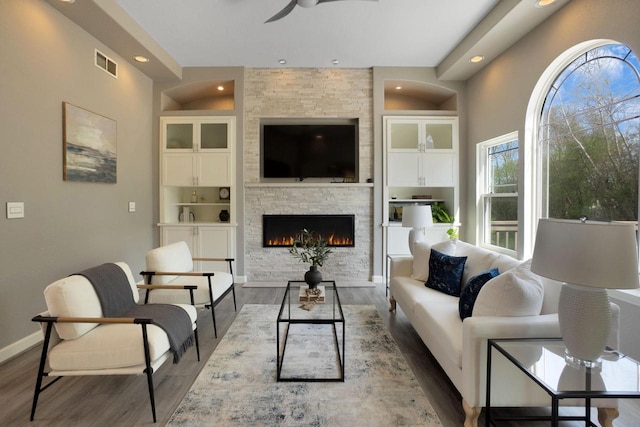 N53W16789 Prairie Dawn, Menomonee Falls, WI 53051 - living room with wood finished floors, ceiling fan, a fireplace, recessed lighting, and baseboards