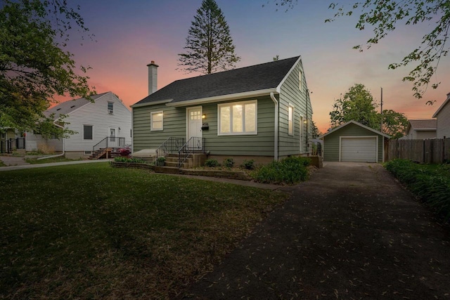 4516 Maher Ave, Madison, WI 53716 - bungalow featuring driveway, a garage, an outdoor structure, and a chimney