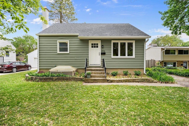 4516 Maher Ave, Madison, WI 53716 - bungalow-style house featuring a front yard, a chimney, and roof with shingles