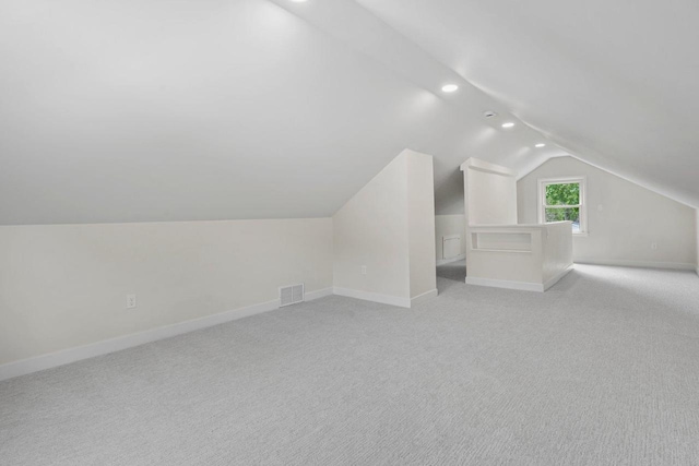 4516 Maher Ave, Madison, WI 53716 - bonus room with lofted ceiling, baseboards, recessed lighting, and light colored carpet