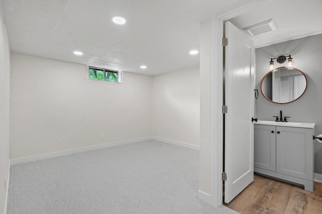 4516 Maher Ave, Madison, WI 53716 - below grade area featuring recessed lighting, baseboards, a sink, and carpet floors