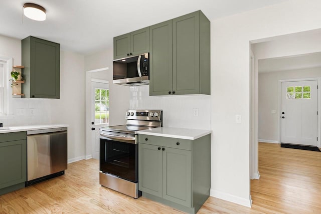 4516 Maher Ave, Madison, WI 53716 - kitchen with green cabinetry, appliances with stainless steel finishes, and light wood-style flooring