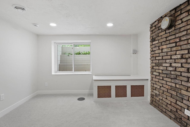 4516 Maher Ave, Madison, WI 53716 - carpeted empty room featuring a textured ceiling, baseboards, brick wall, recessed lighting, and a smoke detector