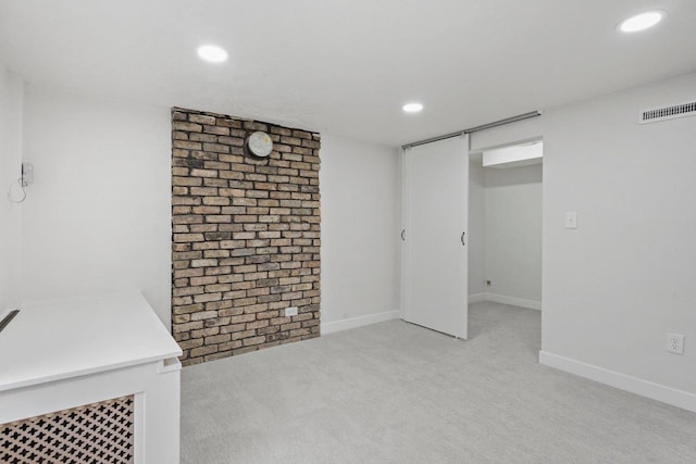 4516 Maher Ave, Madison, WI 53716 - finished below grade area with light carpet, recessed lighting, baseboards, and brick wall