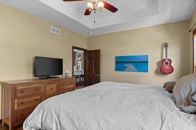 805 Mourning Dove Dr, Cottage Grove, WI 53527 - bedroom featuring a tray ceiling and a ceiling fan