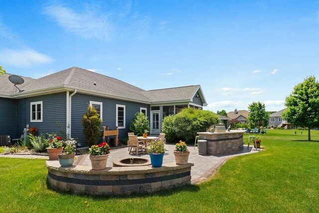 805 Mourning Dove Dr, Cottage Grove, WI 53527 - rear view of property featuring a patio, a lawn, and a shingled roof