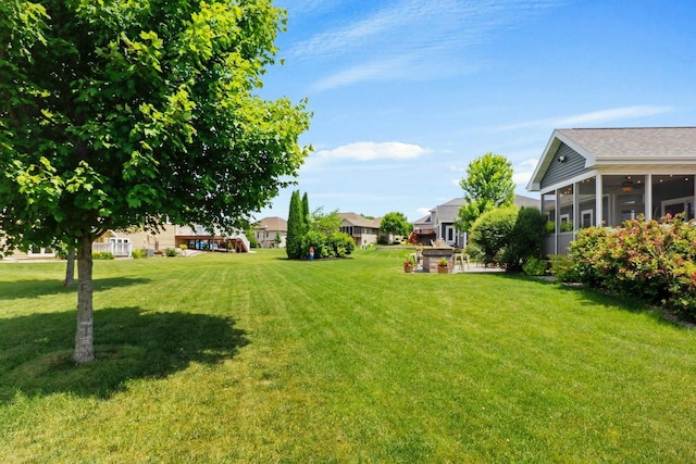 805 Mourning Dove Dr, Cottage Grove, WI 53527 - view of green lawn with a sunroom and ceiling fan