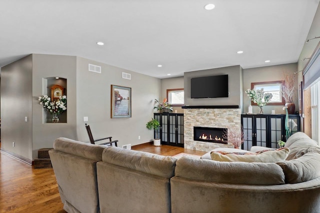 805 Mourning Dove Dr, Cottage Grove, WI 53527 - living room with wood finished floors, a stone fireplace, and recessed lighting