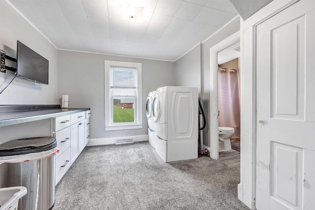 3265 County Road C, Oconto Falls, WI 54154 - laundry area featuring crown molding, light colored carpet, washer / clothes dryer, baseboards, and cabinet space