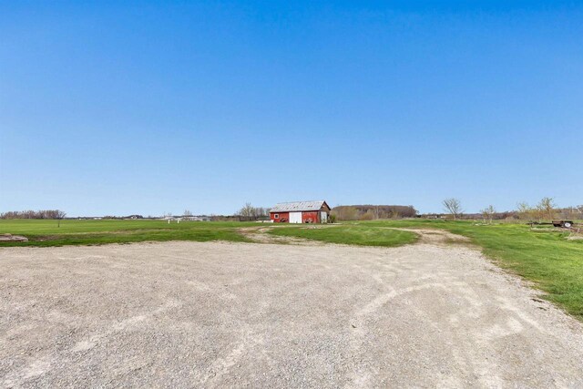 3265 County Road C, Oconto Falls, WI 54154 - view of front of home with a barn, an outdoor structure, and a view of rural / pastoral area