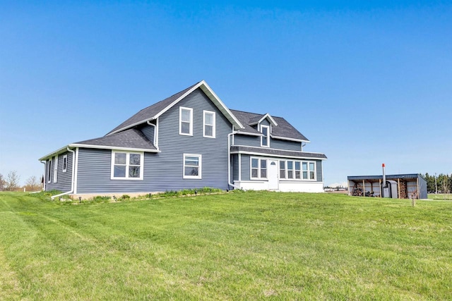 3265 County Road C, Oconto Falls, WI 54154 - rear view of property with a lawn and a shingled roof