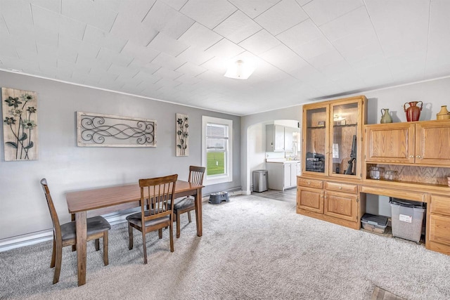 3265 County Road C, Oconto Falls, WI 54154 - dining room with arched walkways, light colored carpet, and washer / clothes dryer