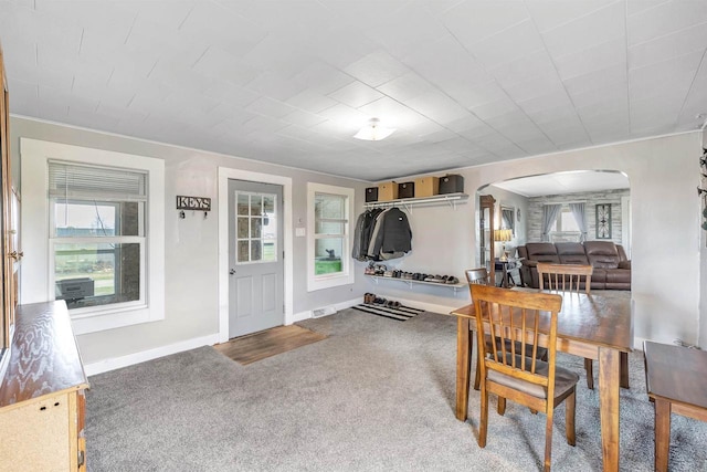 3265 County Road C, Oconto Falls, WI 54154 - dining room with arched walkways, carpet flooring, and baseboards