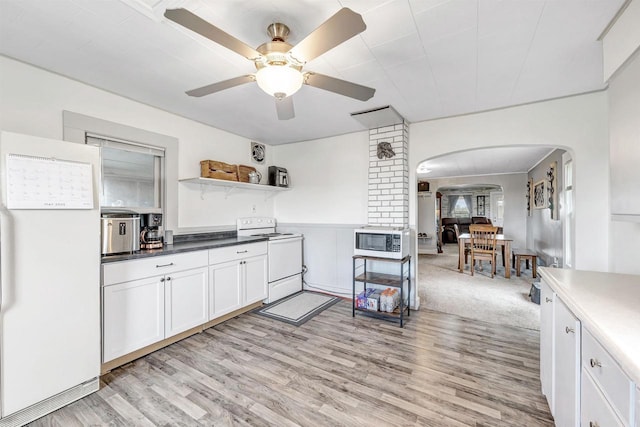 3265 County Road C, Oconto Falls, WI 54154 - kitchen with white appliances, arched walkways, light wood-style floors, and ceiling fan